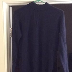 Dark blue pullover sweater. Zipper in the back.